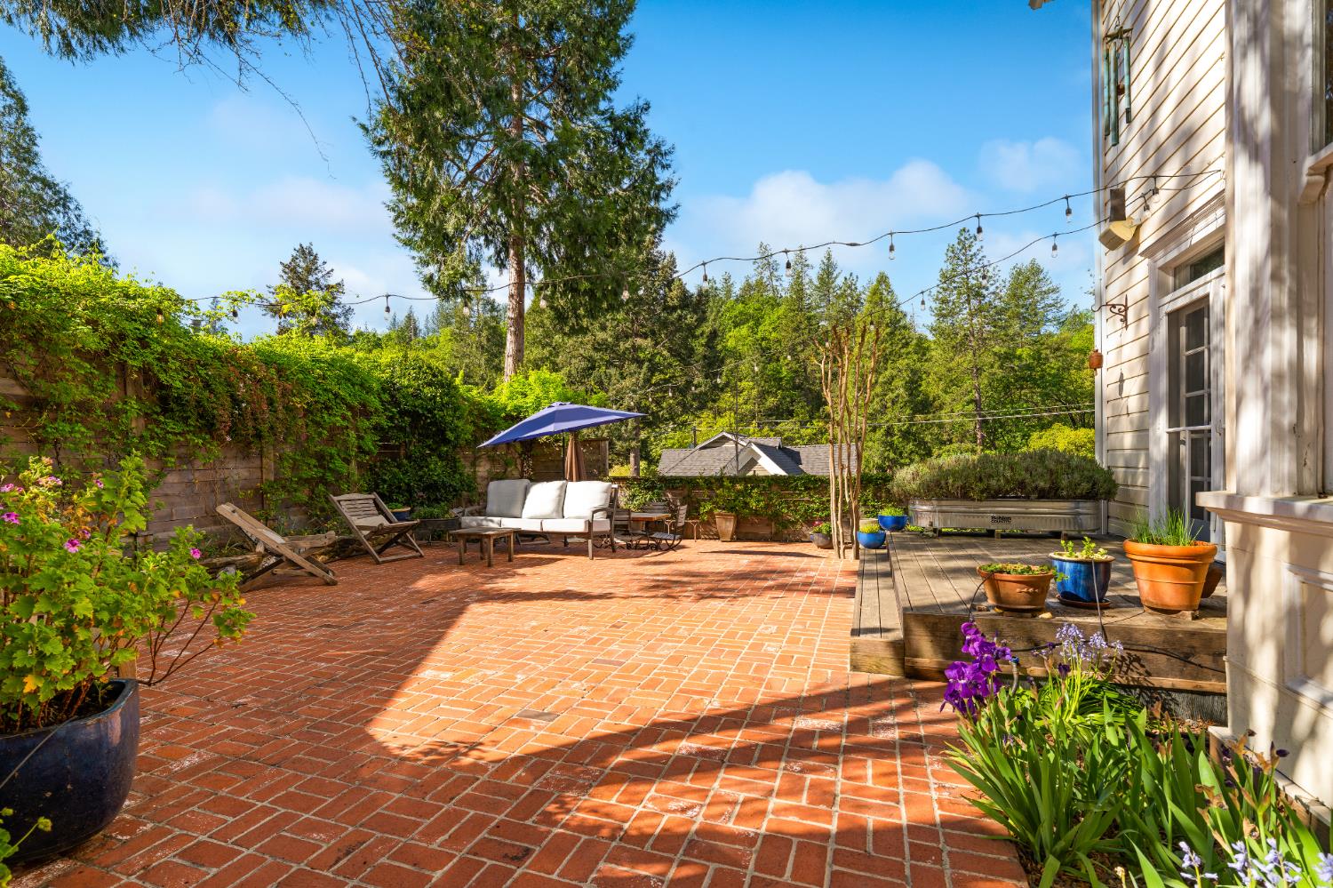 990 Thompson Way Placerville, CA 95667 - Photo 30 of 70 a view of a yard with plants and a fountain
