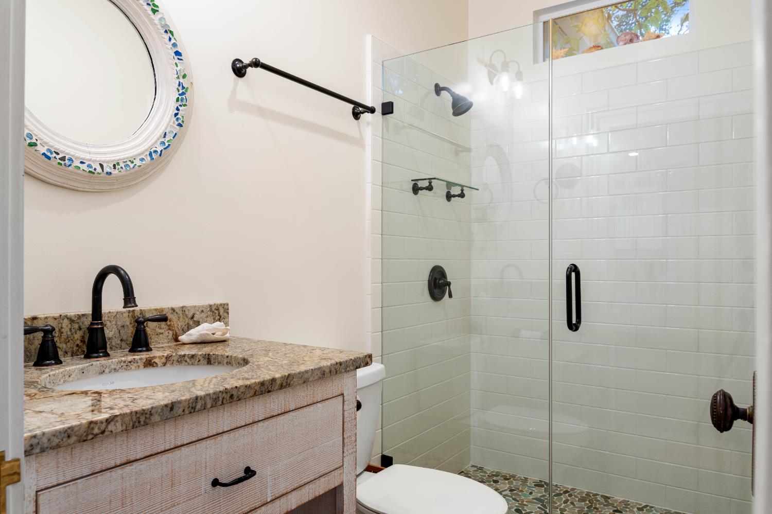 990 Thompson Way Placerville, CA 95667 - Photo 45 of 70 a bathroom with a granite countertop sink a toilet and a mirror