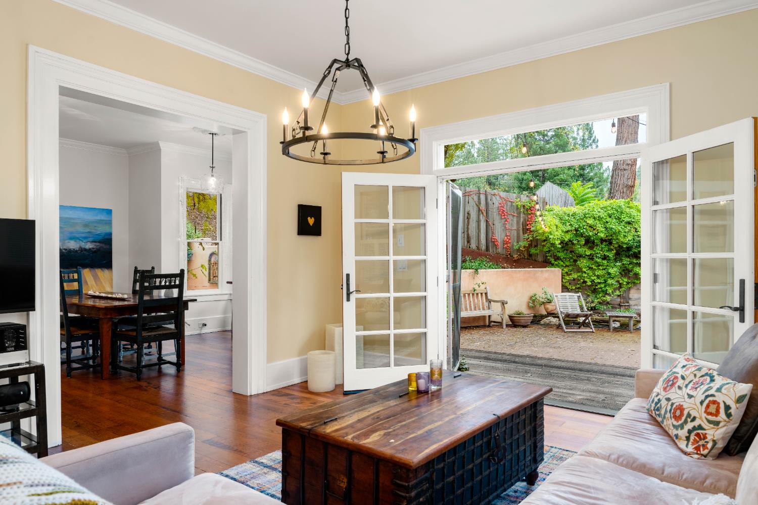 990 Thompson Way Placerville, CA 95667 - Photo 7 of 70 a living room with furniture a dining table and a floor to ceiling window