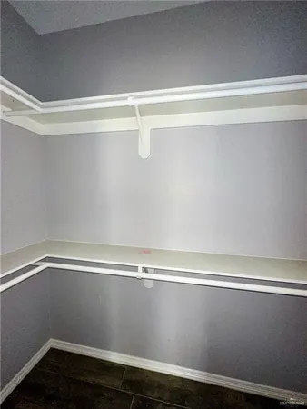an empty room with a ceiling fan
