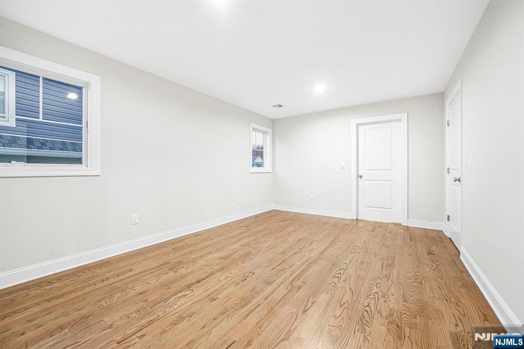 18 Birdie Lane Boonton, NJ 07005 - Photo 20 of 36 a view of empty room with wooden floor