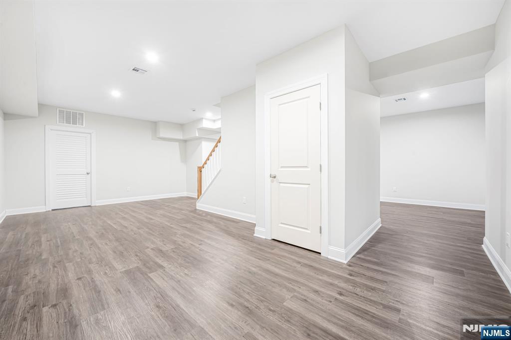 18 Birdie Lane Boonton, NJ 07005 - Photo 24 of 36 a view of empty room with wooden floor