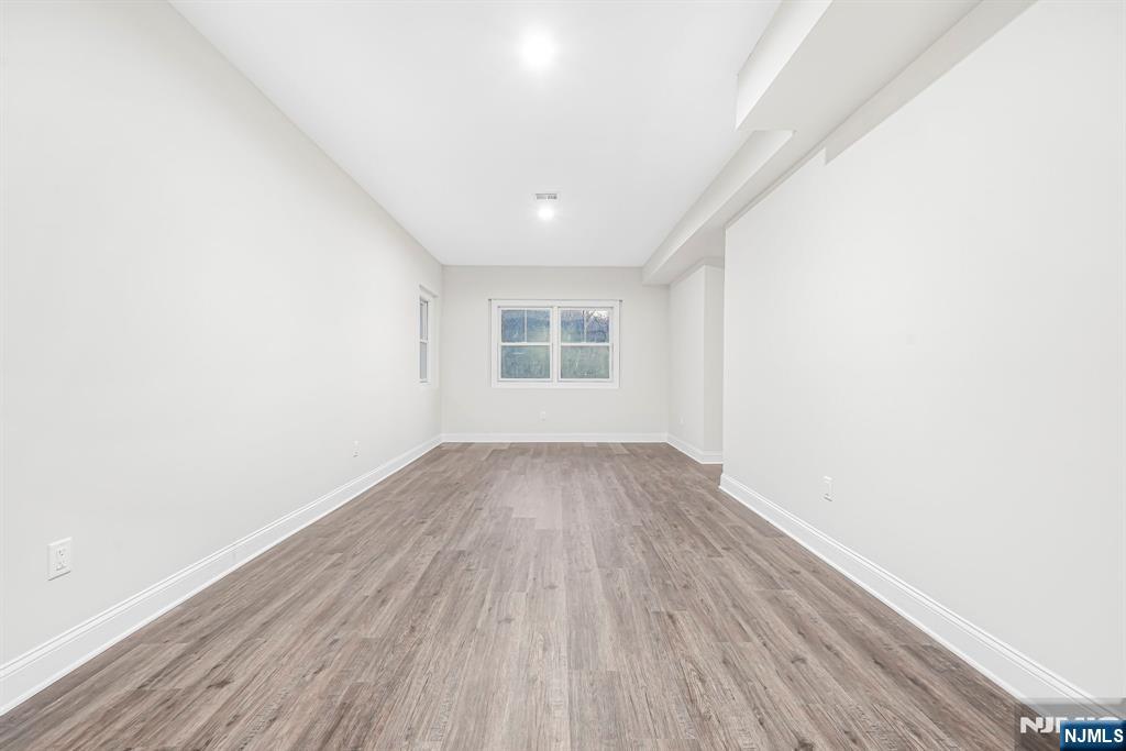 18 Birdie Lane Boonton, NJ 07005 - Photo 25 of 36 a view of a room with wooden floor and window