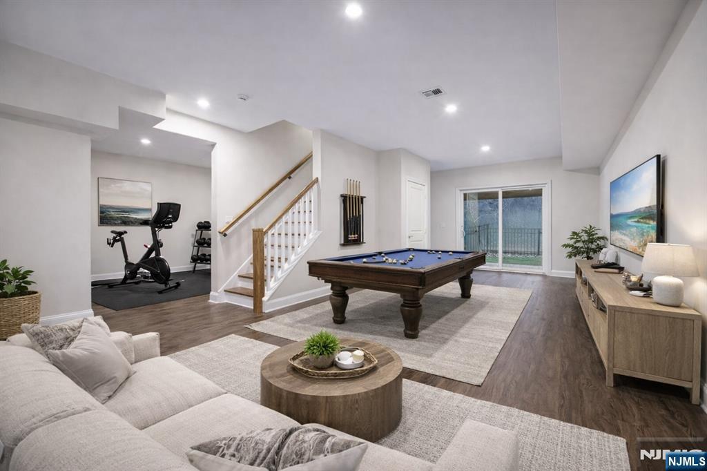18 Birdie Lane Boonton, NJ 07005 - Photo 3 of 36 a living room with furniture and a wooden floor