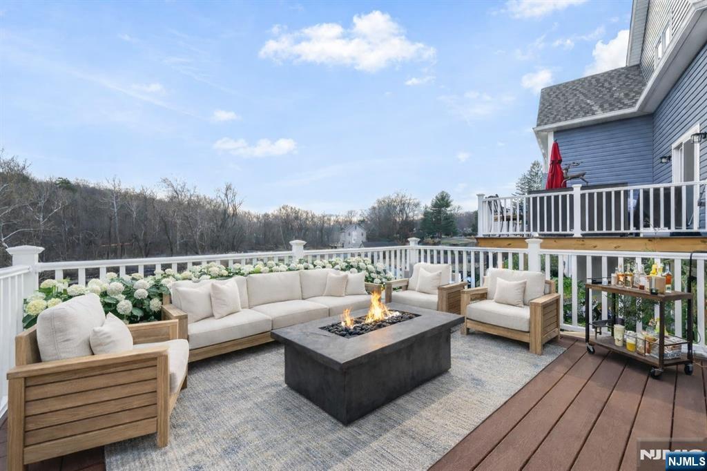 18 Birdie Lane Boonton, NJ 07005 - Photo 7 of 36 a view of a roof deck with couches