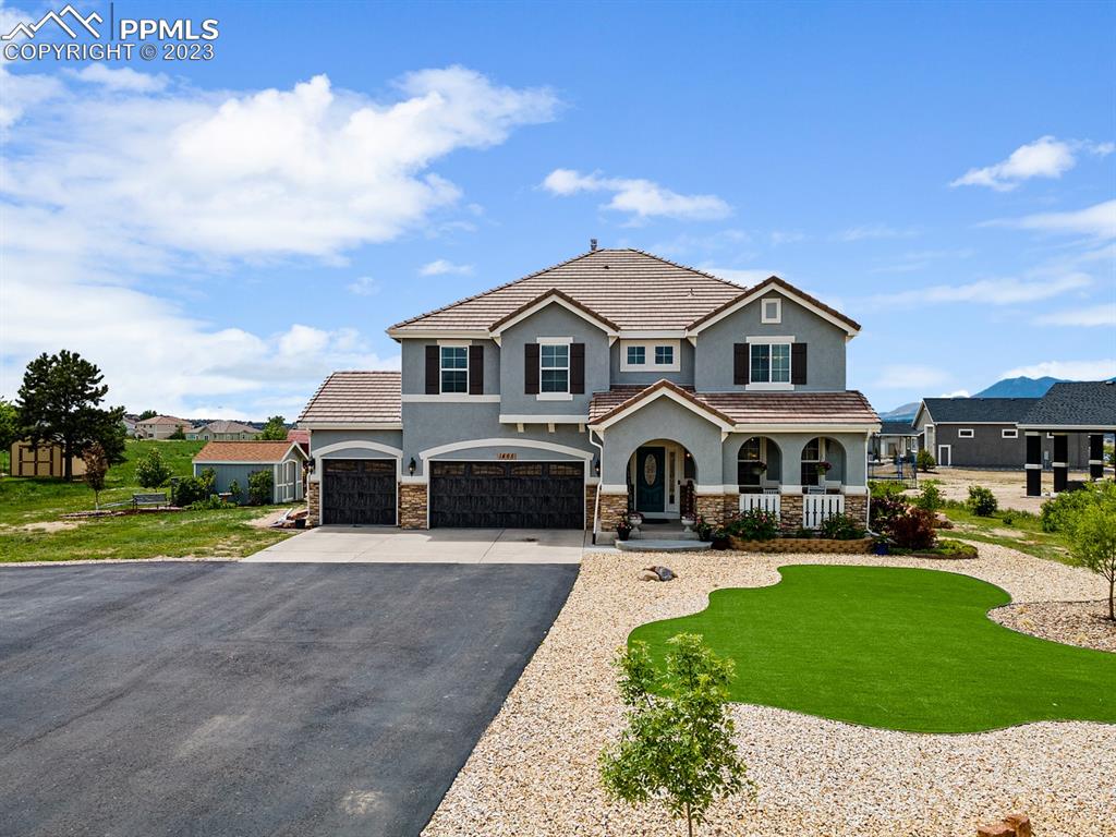 a front view of a house with a yard