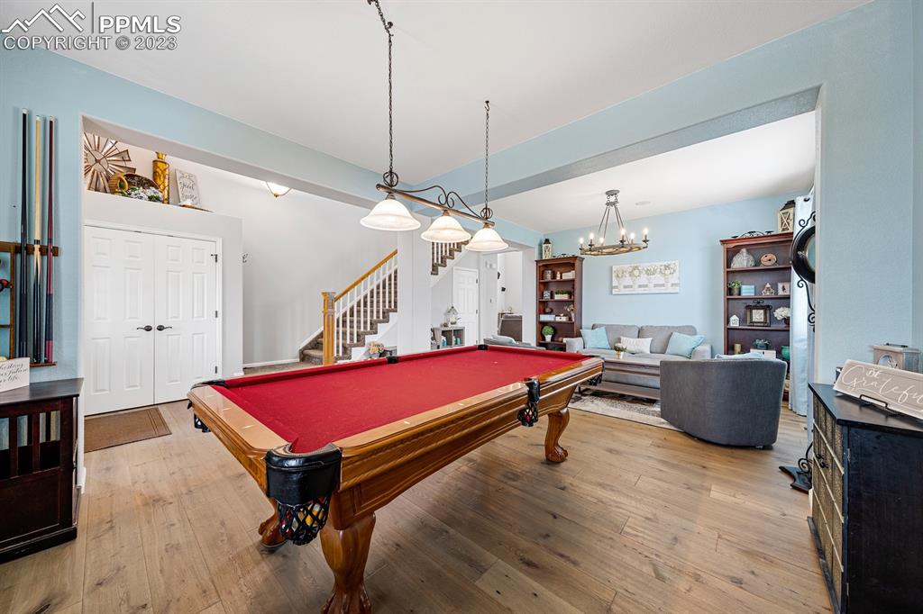 1465 Bowstring Road Monument, CO 80132 - Photo 12 of 49 a room with furniture pool table and window