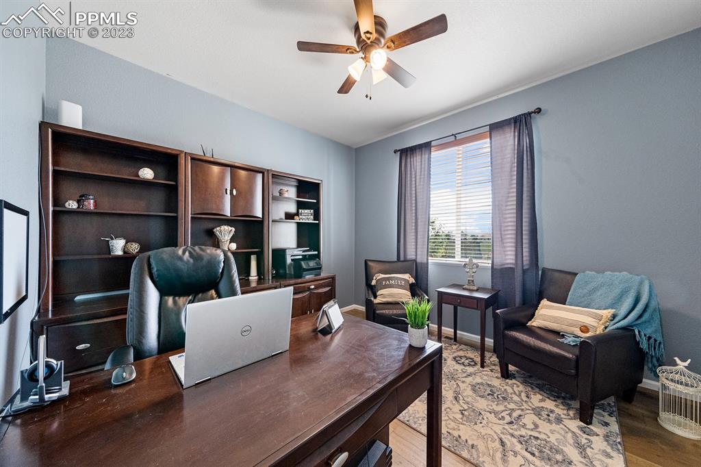 1465 Bowstring Road Monument, CO 80132 - Photo 22 of 49 a living room with furniture and a window