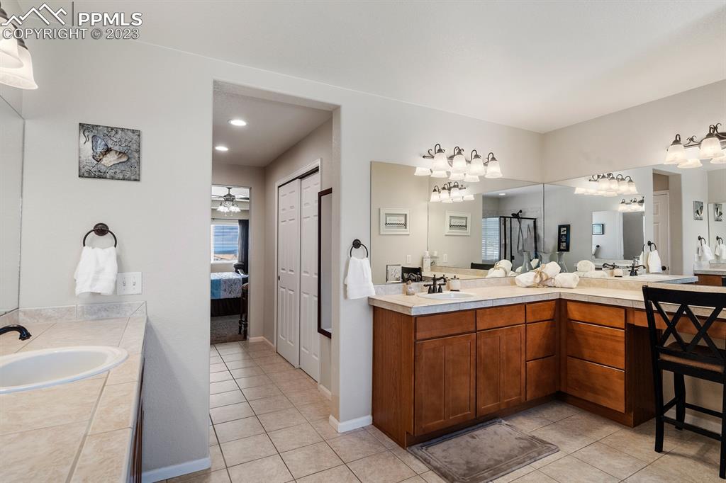 1465 Bowstring Road Monument, CO 80132 - Photo 28 of 49 a kitchen with a sink and cabinets