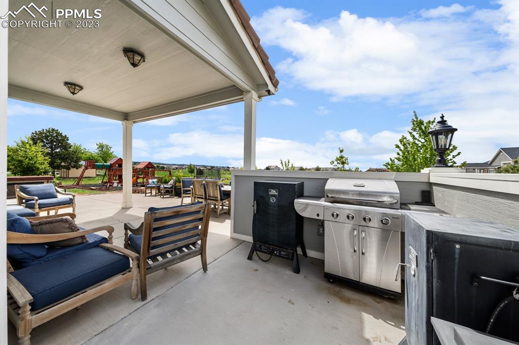 1465 Bowstring Road Monument, CO 80132 - Photo 36 of 49 a view of roof deck with furniture and garden