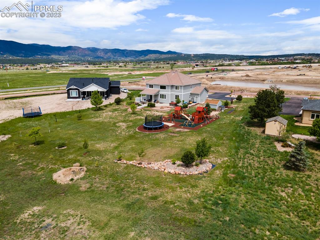 1465 Bowstring Road Monument, CO 80132 - Photo 4 of 49 a view of a lake with a mountain