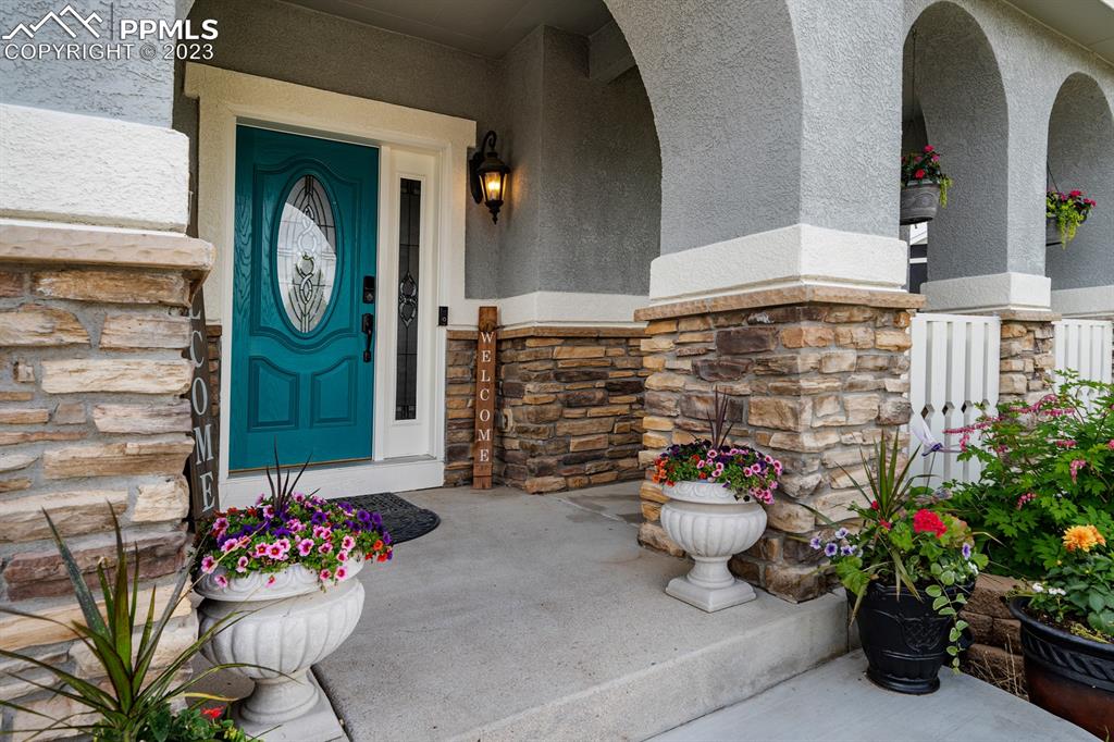 1465 Bowstring Road Monument, CO 80132 - Photo 10 of 49 a front view of a house with outdoor seating