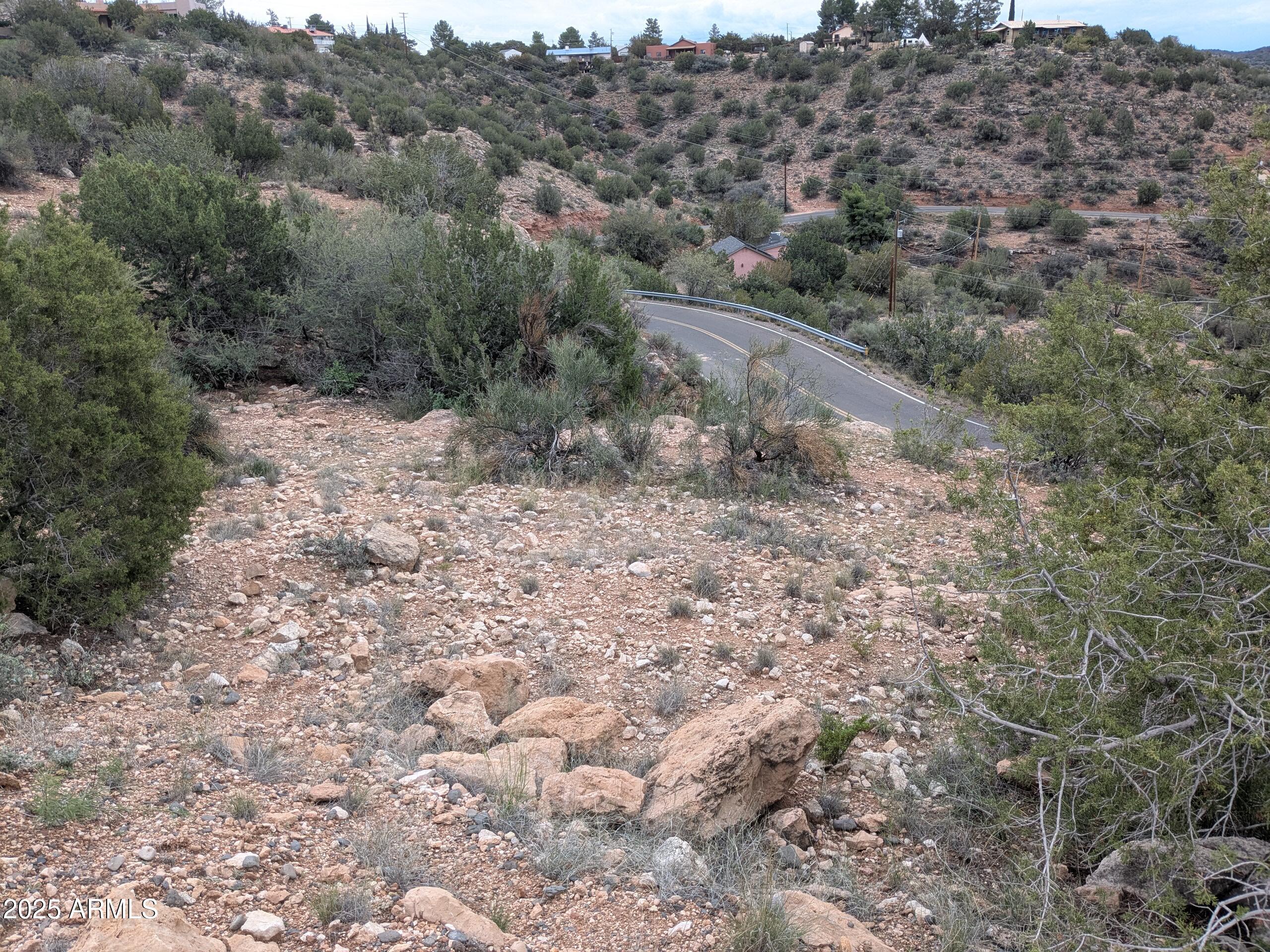 4425 East Cliffside Trail, Unit 101 Rimrock, AZ 86335 - Photo 5 of 9 a view of a dry yard with green space and fog