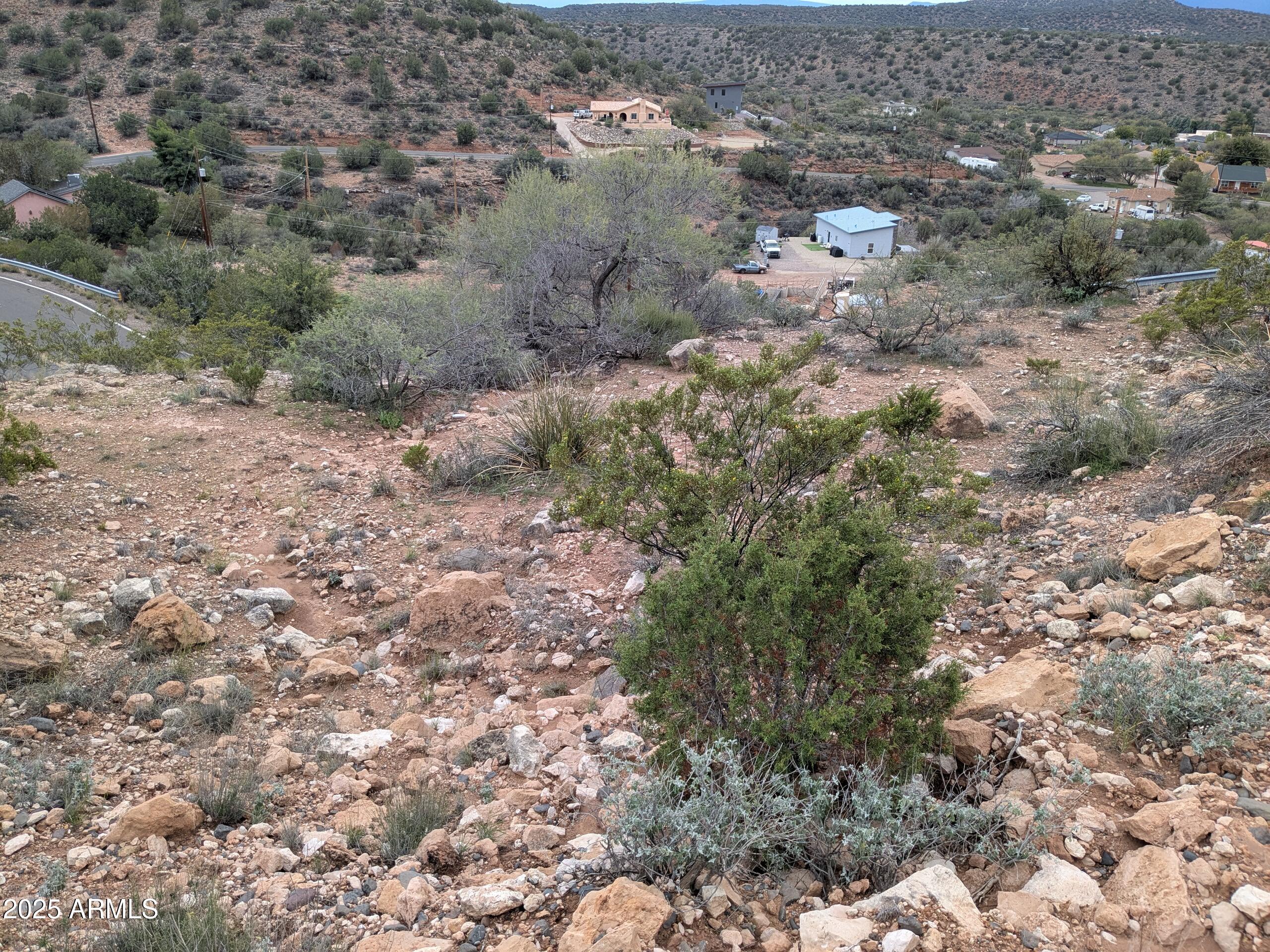 4425 East Cliffside Trail, Unit 101 Rimrock, AZ 86335 - Photo 6 of 9 a view of a yard with a plants and tree