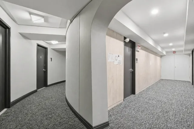 a view of hallway with livingroom