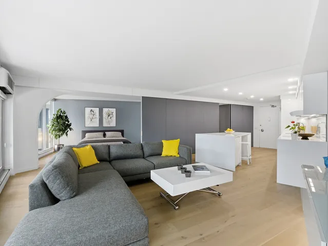 a living room with furniture and a couch