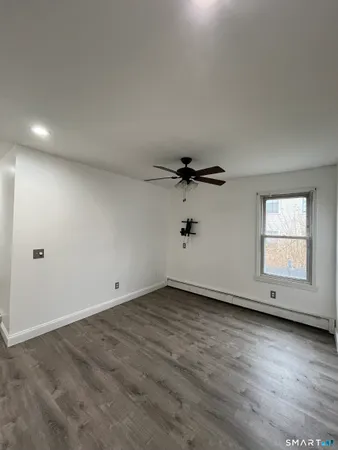 an empty room with a empty space and windows