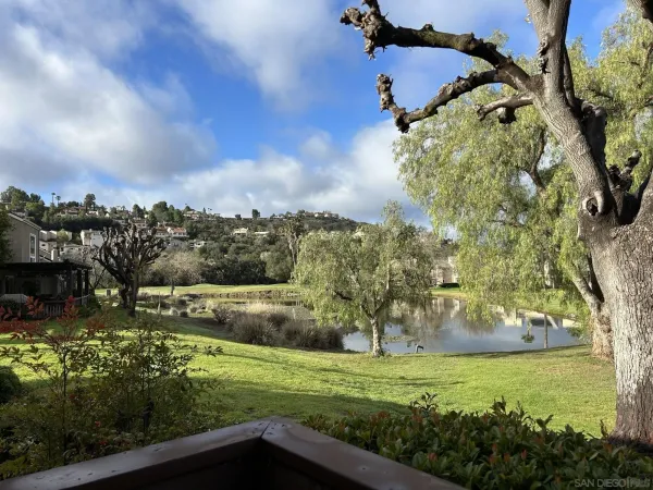 an aerial view of a houses with yard