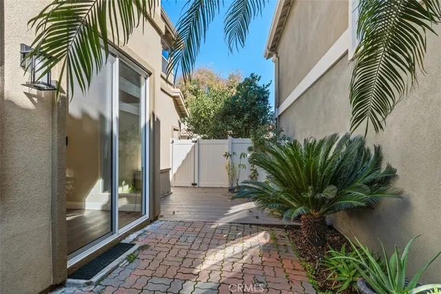 a view of a palm trees front of house