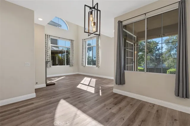 a view of an entryway with wooden floor and door