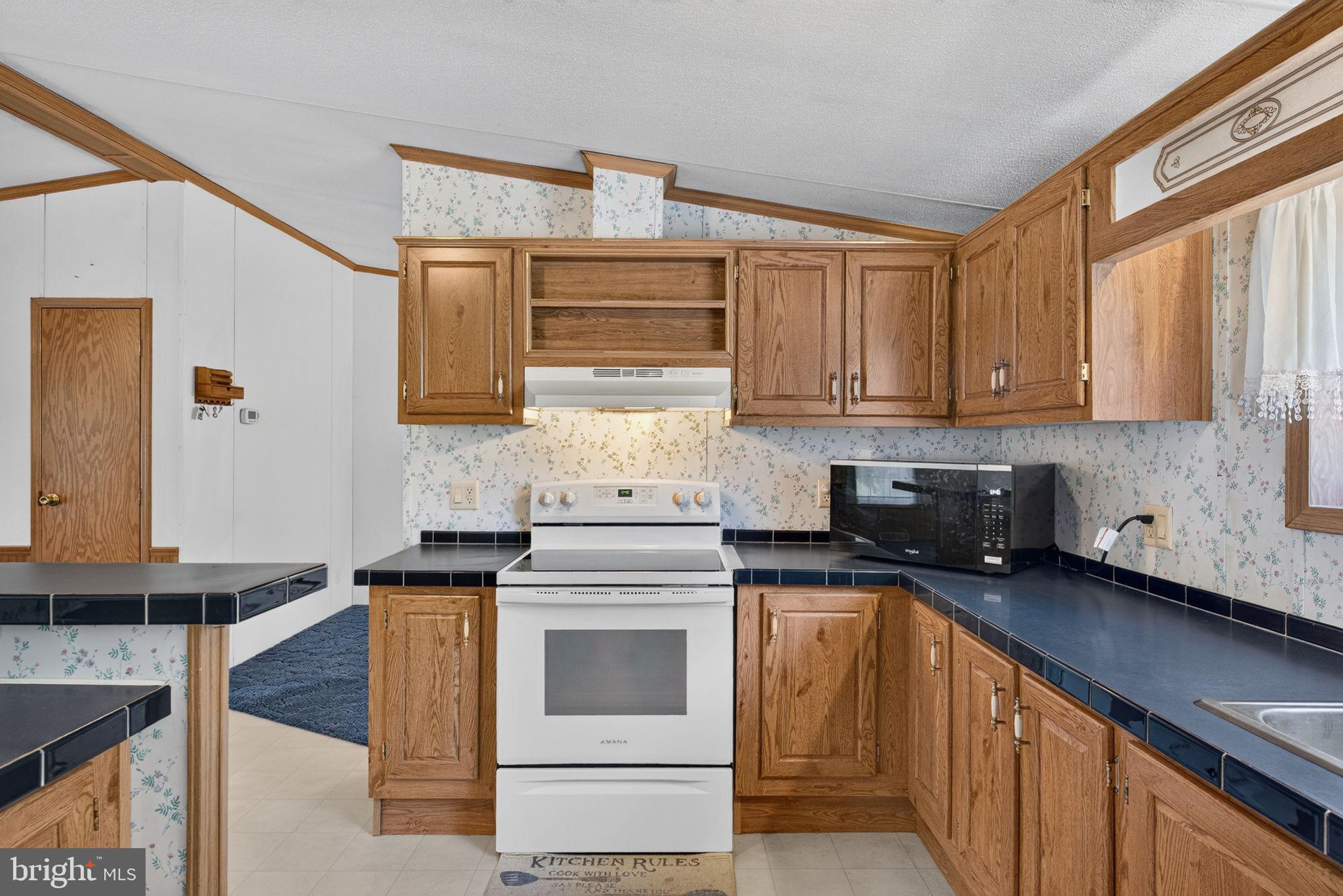 1910 Schubert Road, Unit 8 Bethel, PA 19507 - Photo 10 of 40 Smooth top stove is also included