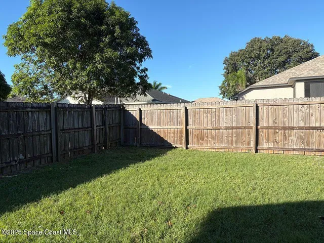 a view of backyard with green space