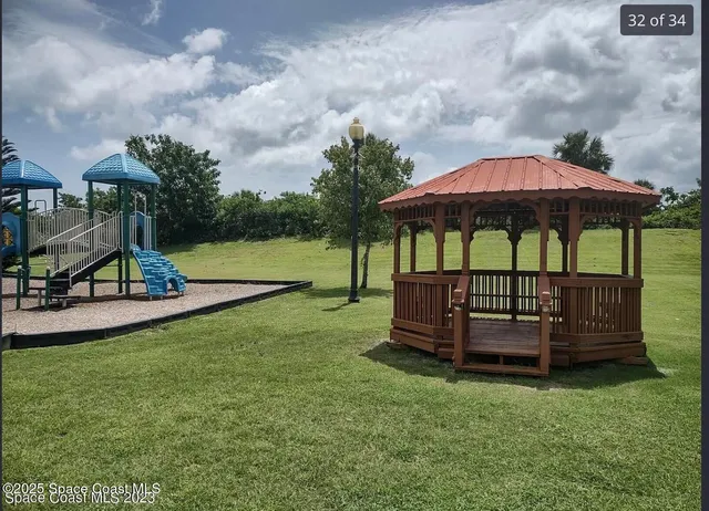 a view of a garden with a slide