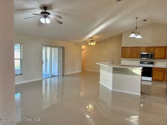 a view of a kitchen with a sink and dishwasher