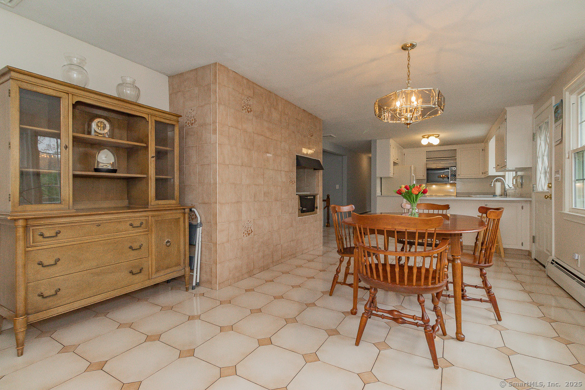 97 Longview Drive Berlin, CT 06037 - Photo 11 of 39 a view of a dining room with furniture