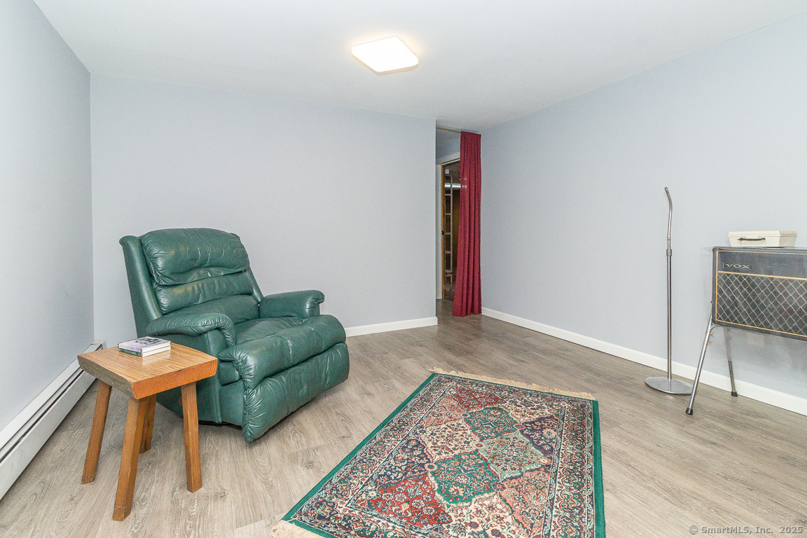 97 Longview Drive Berlin, CT 06037 - Photo 34 of 39 a living room with furniture and a rug
