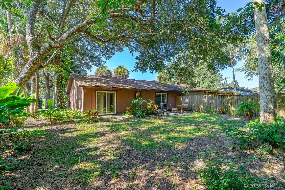 1109 Regent Street Edgewater, FL 32132 - Photo 21 of 27 a view of a house with backyard and sitting area
