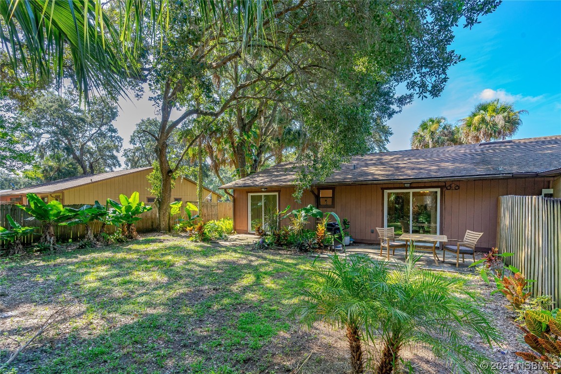 1109 Regent Street Edgewater, FL 32132 - Photo 23 of 27 a view of a house with backyard garden and sitting area