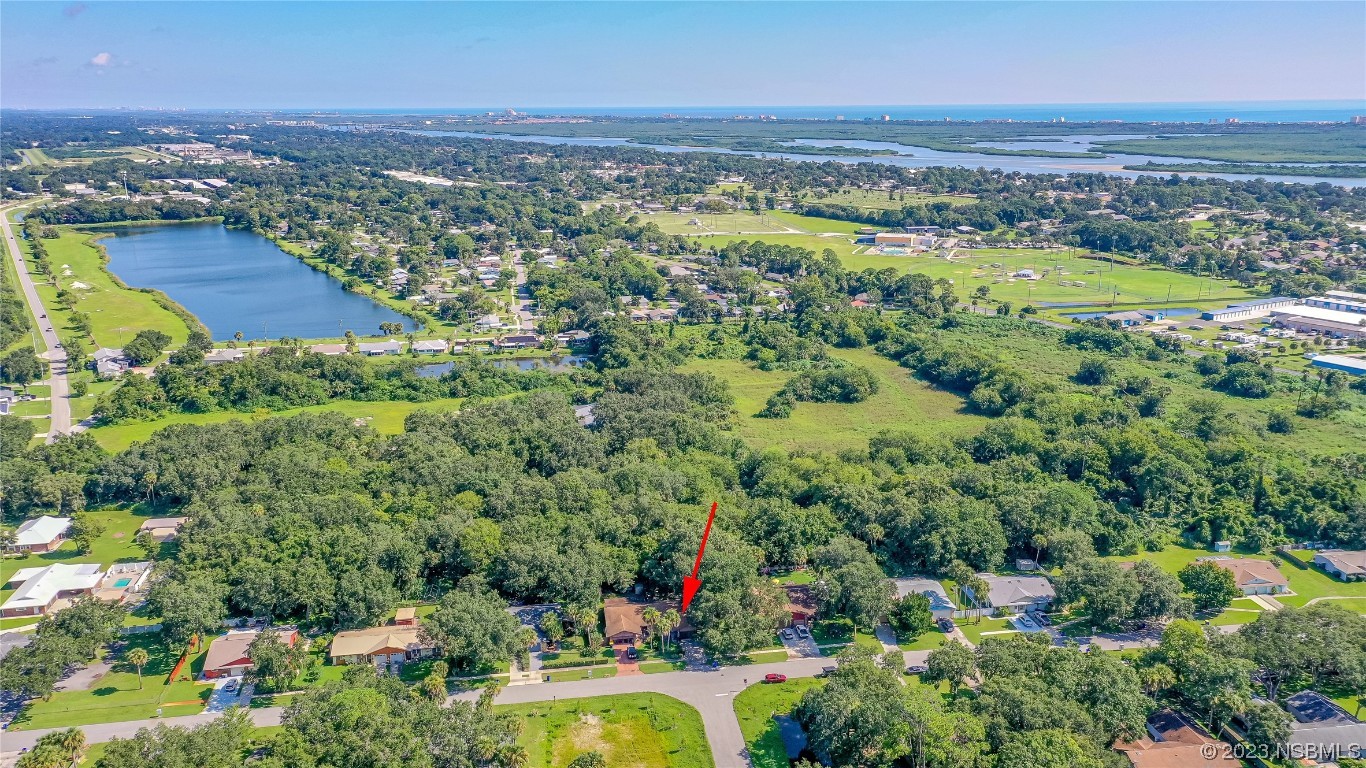 1109 Regent Street Edgewater, FL 32132 - Photo 27 of 27 an aerial view of residential houses with outdoor space and swimming pool