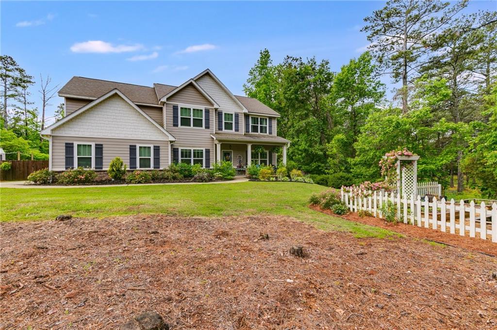 13 Westbrook Road Carrollton, GA 30116 - Photo 2 of 39 a view of house with a big yard and potted plants