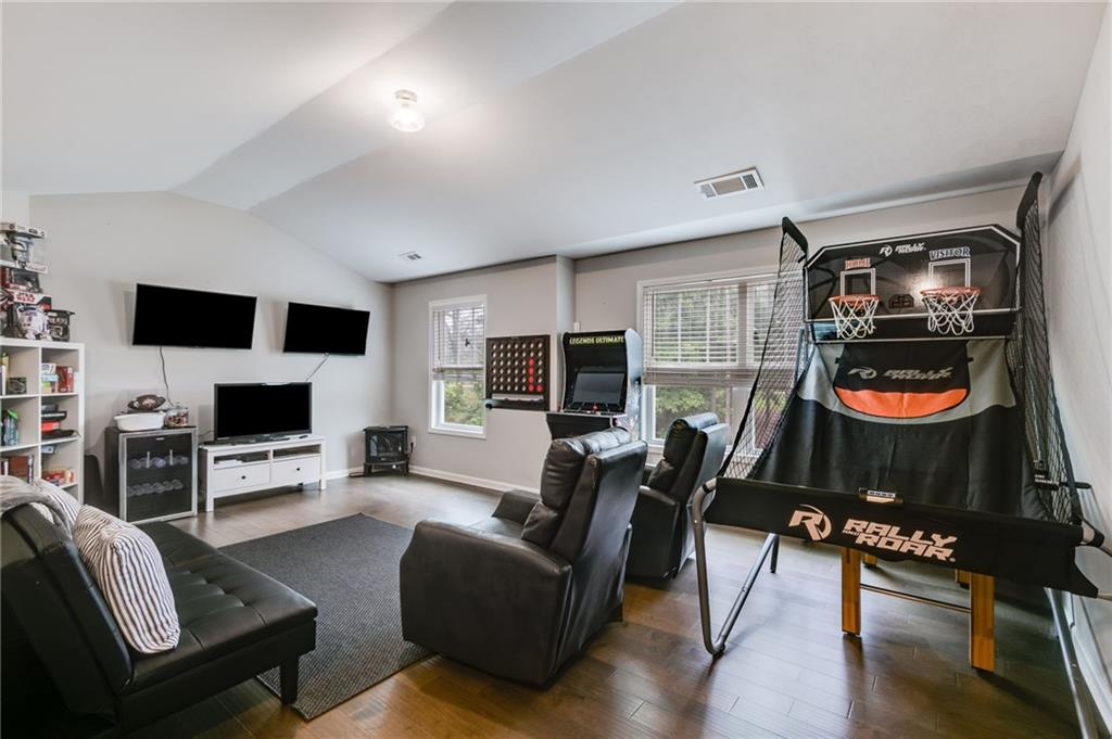 13 Westbrook Road Carrollton, GA 30116 - Photo 23 of 39 a living room with furniture and a flat screen tv