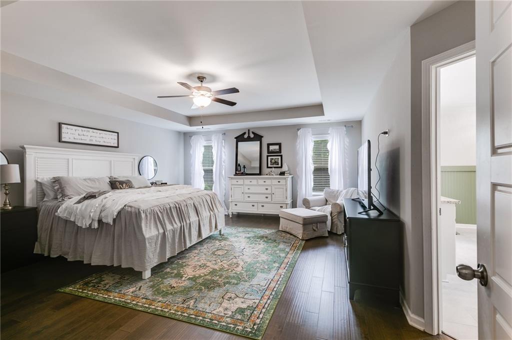 13 Westbrook Road Carrollton, GA 30116 - Photo 24 of 39 a bedroom with a large bed and a chandelier