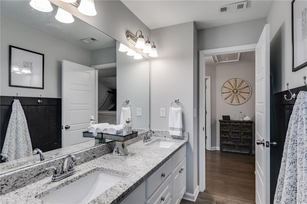 13 Westbrook Road Carrollton, GA 30116 - Photo 26 of 39 a bathroom with double vanity and a mirror