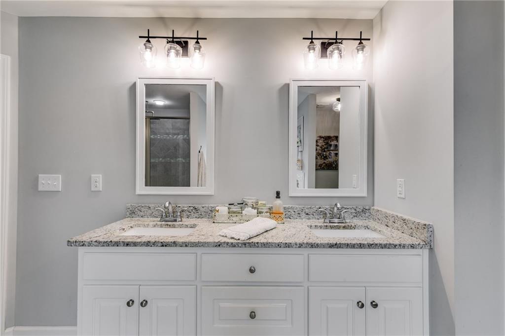 13 Westbrook Road Carrollton, GA 30116 - Photo 30 of 39 a bathroom with double sink and a mirror