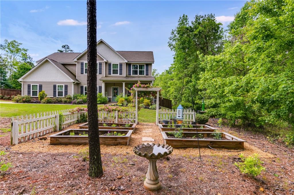 13 Westbrook Road Carrollton, GA 30116 - Photo 4 of 39 a view of a house with backyard and a slide