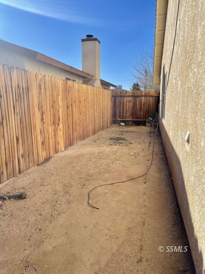 1304 South McCall Street Ridgecrest, CA 93555 - Photo 6 of 22 a view of a room with wooden walls