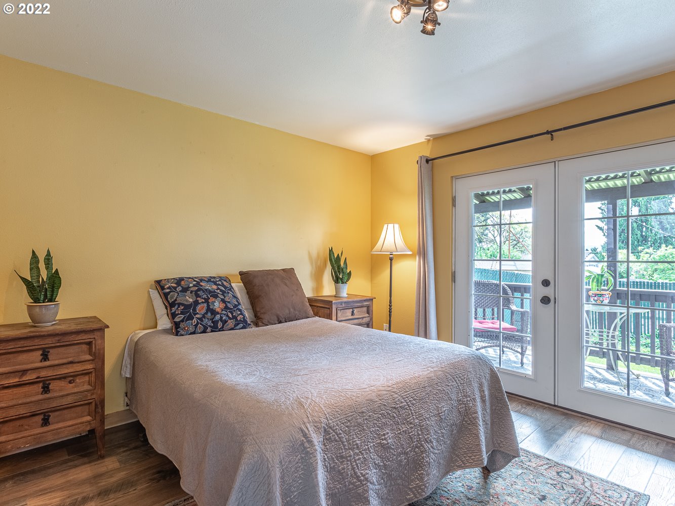 815 North Main Avenue Ridgefield, WA 98642 - Photo 14 of 32 a bedroom with a large bed and a window