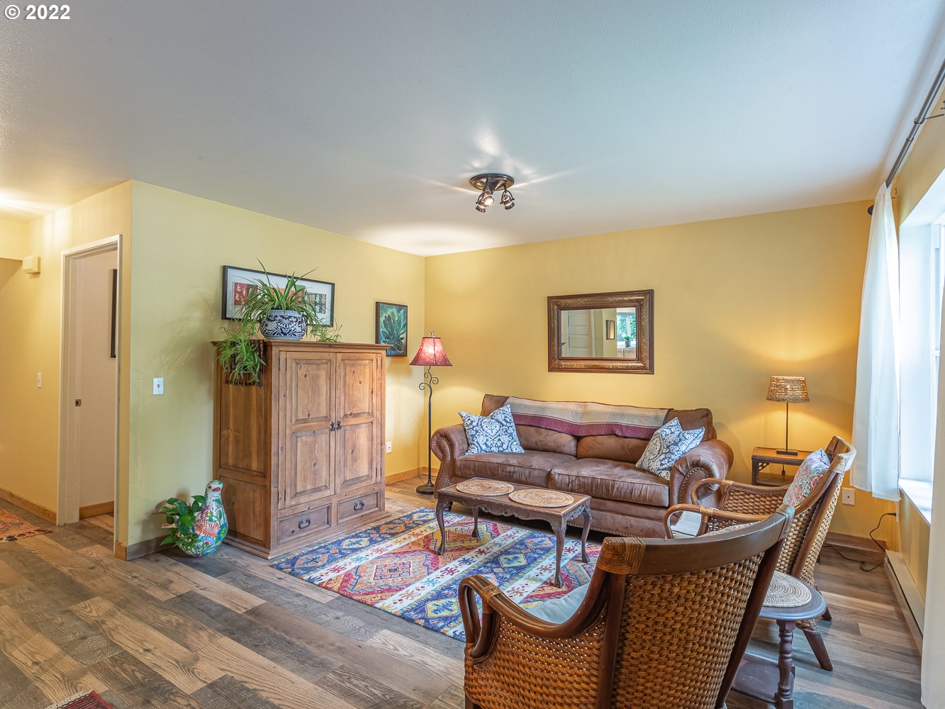 815 North Main Avenue Ridgefield, WA 98642 - Photo 4 of 32 a living room with furniture and wooden floor