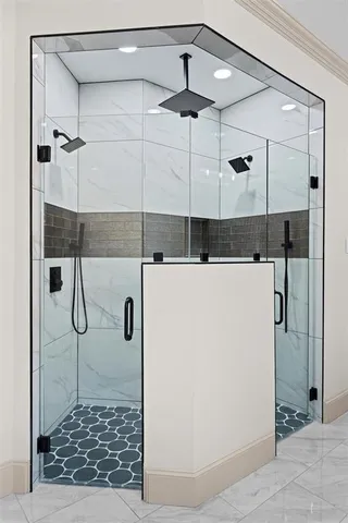 a bathroom with a shower and a mirror