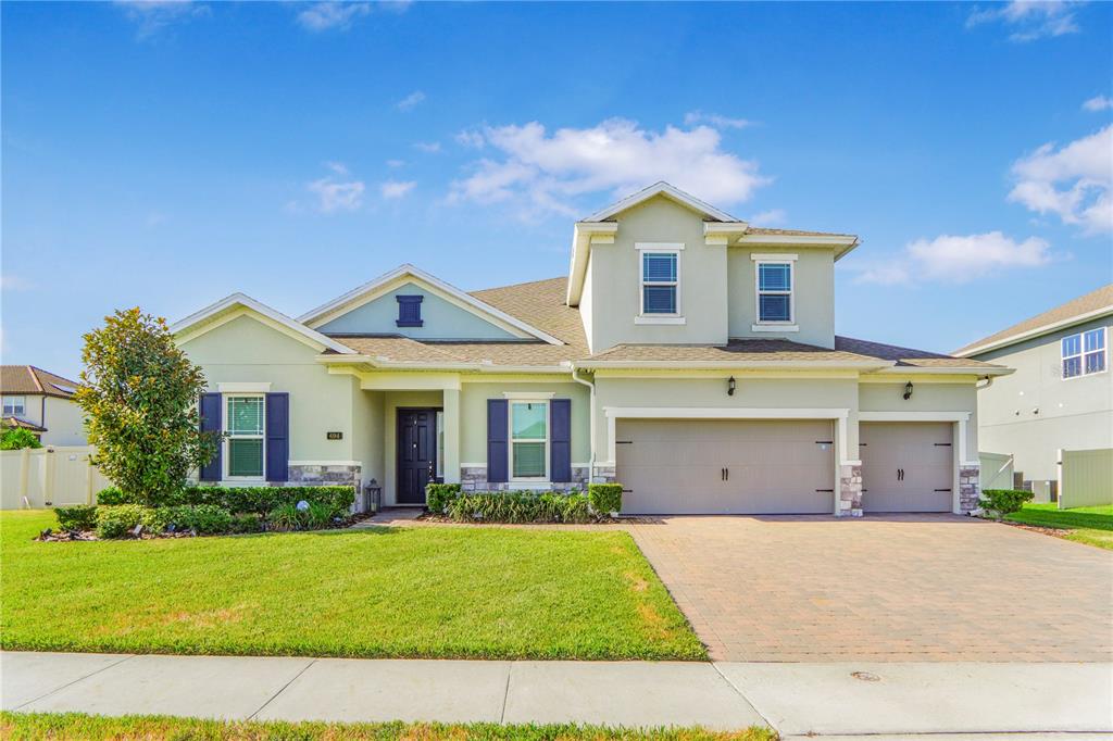 694 Brooks Field Drive Winter Garden, FL 34787 - Photo 1 of 74 a view of a white house with a big yard and potted plants