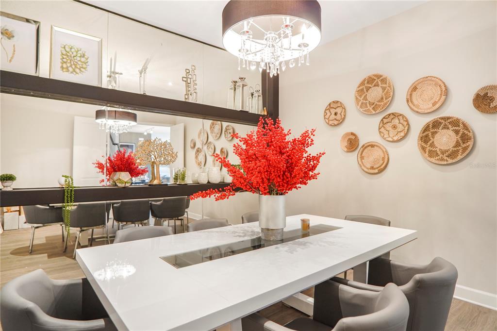 694 Brooks Field Drive Winter Garden, FL 34787 - Photo 18 of 74 a view of a dining room with furniture and chandelier