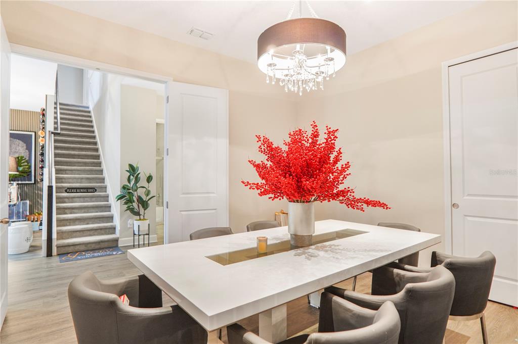 694 Brooks Field Drive Winter Garden, FL 34787 - Photo 19 of 74 a view of a dining room with furniture and wooden floor