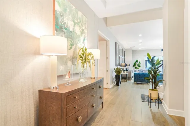 a spacious bathroom with a granite countertop sink and a mirror