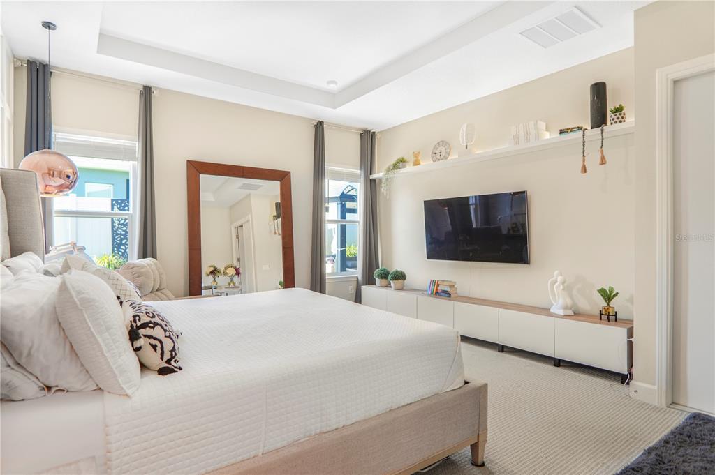 694 Brooks Field Drive Winter Garden, FL 34787 - Photo 22 of 74 a bedroom with a bed and a flat screen tv