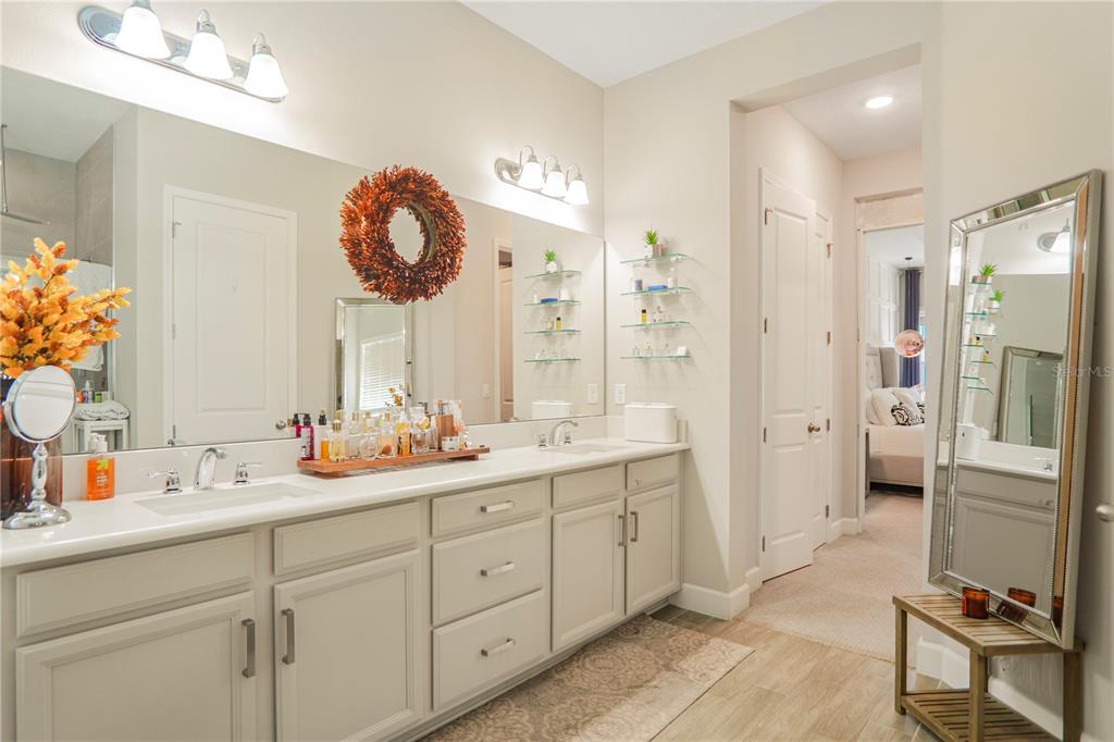 694 Brooks Field Drive Winter Garden, FL 34787 - Photo 25 of 74 a bathroom with a double vanity sink mirror and shower