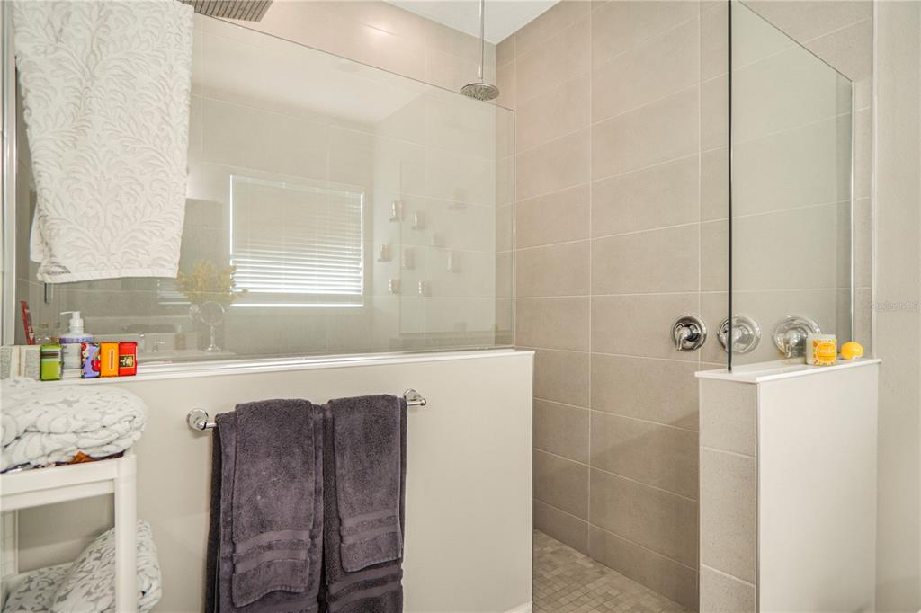 694 Brooks Field Drive Winter Garden, FL 34787 - Photo 26 of 74 a bathroom with a bathtub and a shower